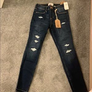 Navy blue ripped jeans